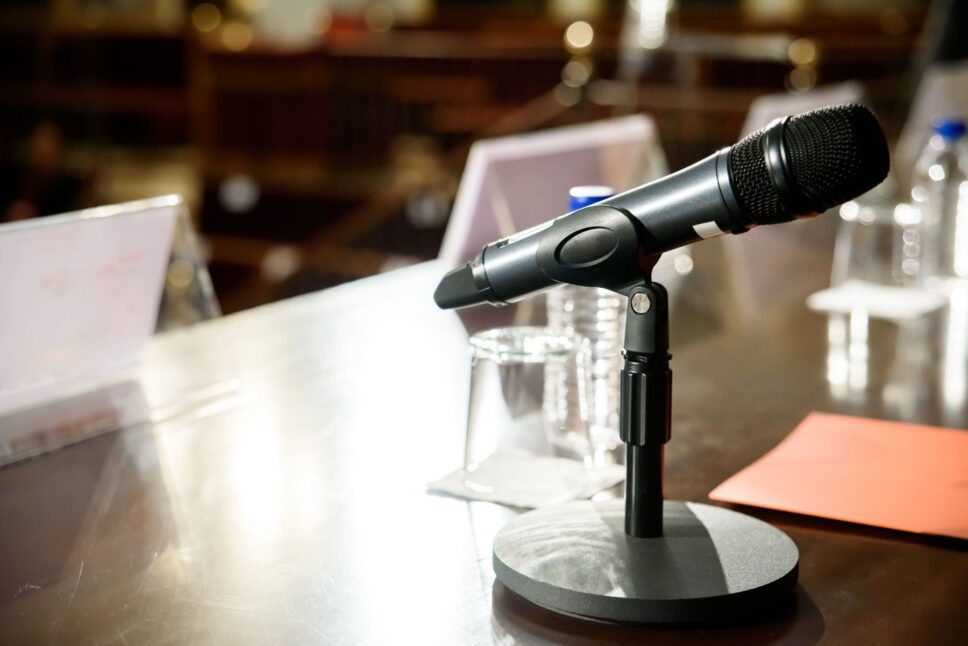 Microphone in conference room to communicate to the audience
