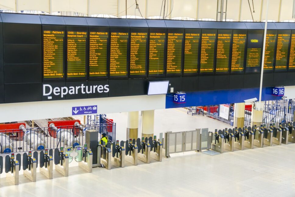Timetable at departures at Waterloo railway station London UK