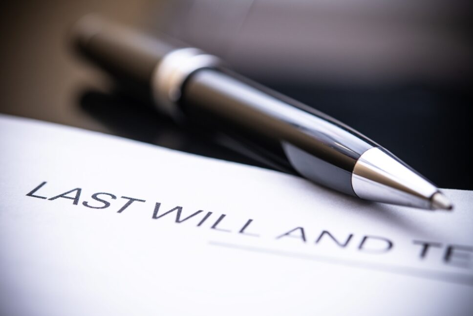 A close-up view of a last will and testament document accompanied by a sleek pen