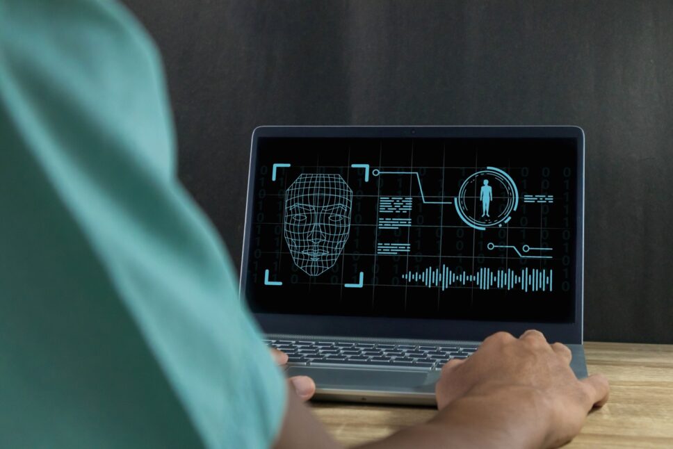 Man-using-a-laptop-to-create-convincing-fake-image