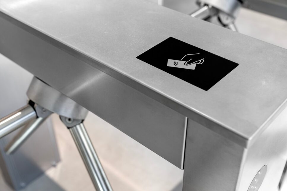card access control system on modern stainless steel turnstile gate in smart office building